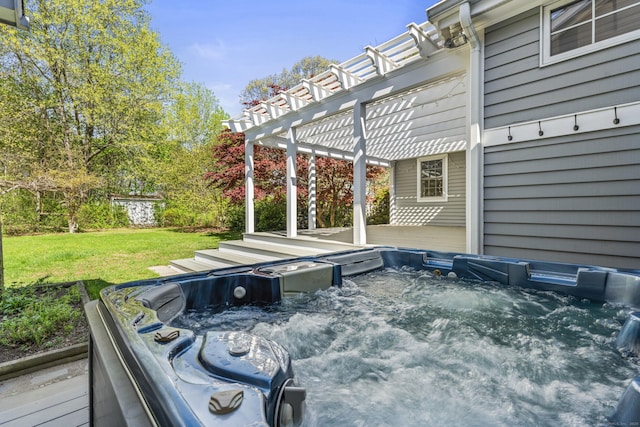 deck with a hot tub, a pergola, and a lawn