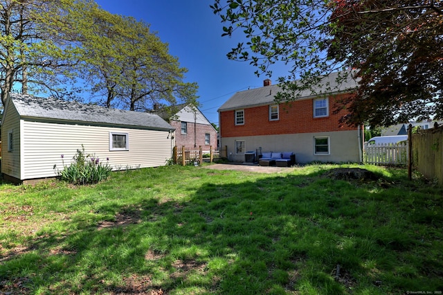 172 Alden St, Fairfield, CT 06824 - back of property featuring an outdoor hangout area, a chimney, and an outbuilding