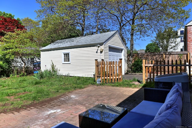 172 Alden St, Fairfield, CT 06824 - view of patio with an outbuilding, an outdoor living space, and a detached garage