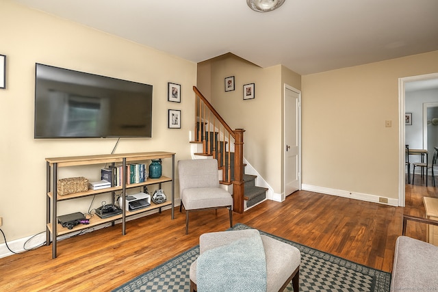 172 Alden St, Fairfield, CT 06824 - living area with wood finished floors, stairs, and baseboards
