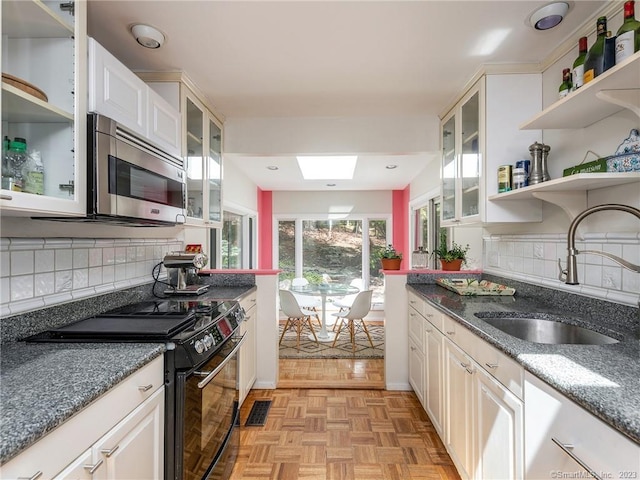95 Shinar Mountain Rd, Washington, CT 06794 - kitchen featuring a sink, stainless steel microwave, open shelves, decorative backsplash, and black range with electric cooktop