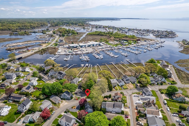 aerial view of numerous boat docks and a nearby body of water