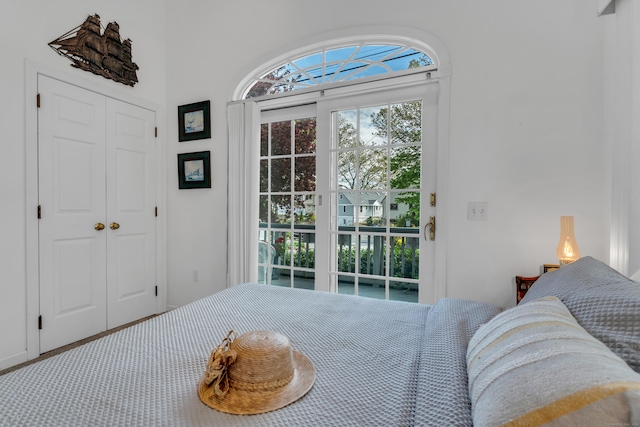 bedroom with a closet and access to outside