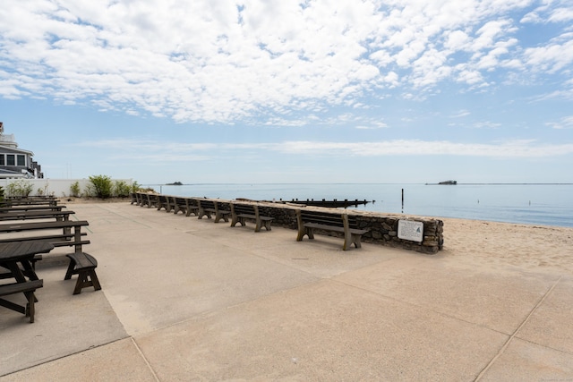 surrounding community featuring a water view