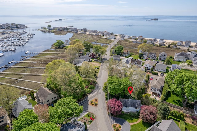 aerial view of residential area with a nearby body of water