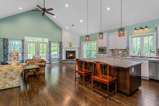 4 Aunt Park Ln, Newtown, CT 06470 - kitchen featuring high vaulted ceiling, open floor plan, stainless steel appliances, a sink, and a center island