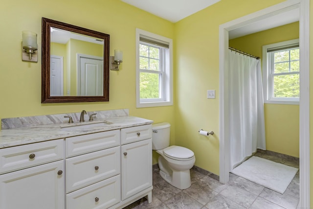 4 Aunt Park Ln, Newtown, CT 06470 - full bath featuring healthy amount of natural light, toilet, vanity, and curtained shower