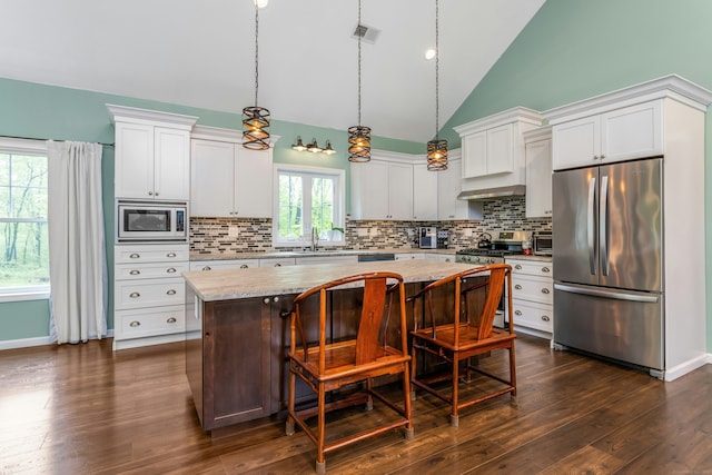 4 Aunt Park Ln, Newtown, CT 06470 - kitchen with stainless steel appliances, a center island, tasteful backsplash, pendant lighting, and high vaulted ceiling