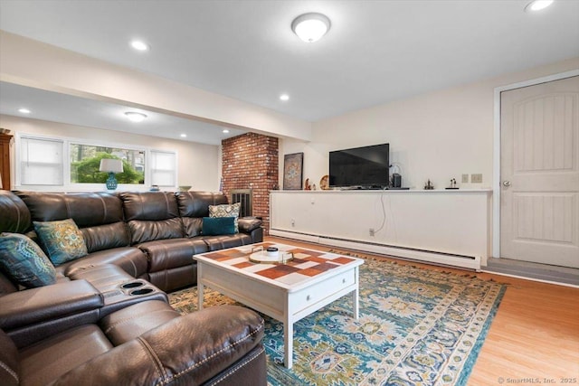living area with beam ceiling, wood finished floors, a baseboard heating unit, and recessed lighting
