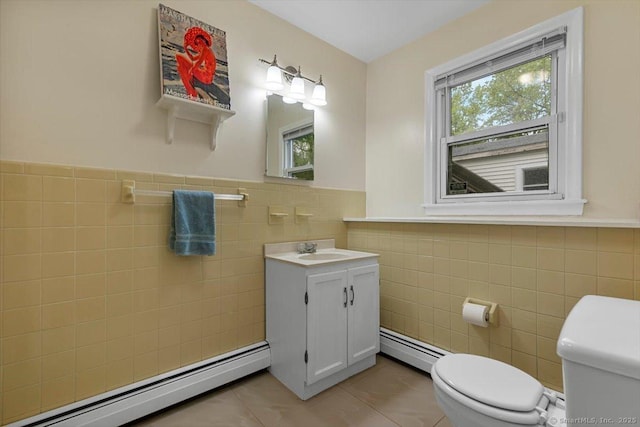 bathroom with a baseboard radiator, tile walls, toilet, and tile patterned flooring