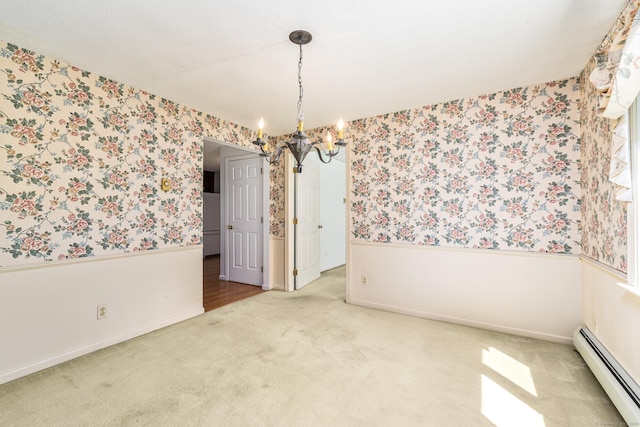 empty room with a baseboard heating unit, wallpapered walls, a chandelier, carpet flooring, and baseboards