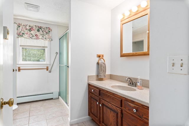 full bath featuring a baseboard radiator, a shower stall, vanity, and tile patterned flooring