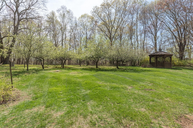 view of green lawn with a gazebo