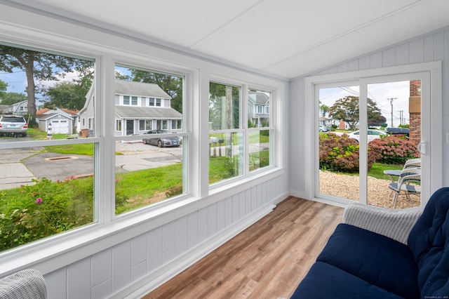 24 Sea Crest Ave, East Lyme, CT 06357 - sunroom / solarium with lofted ceiling, healthy amount of natural light, wood finished floors, and a residential view