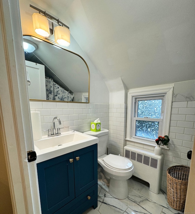full bathroom with tile walls, radiator, lofted ceiling, marble finish floors, and toilet