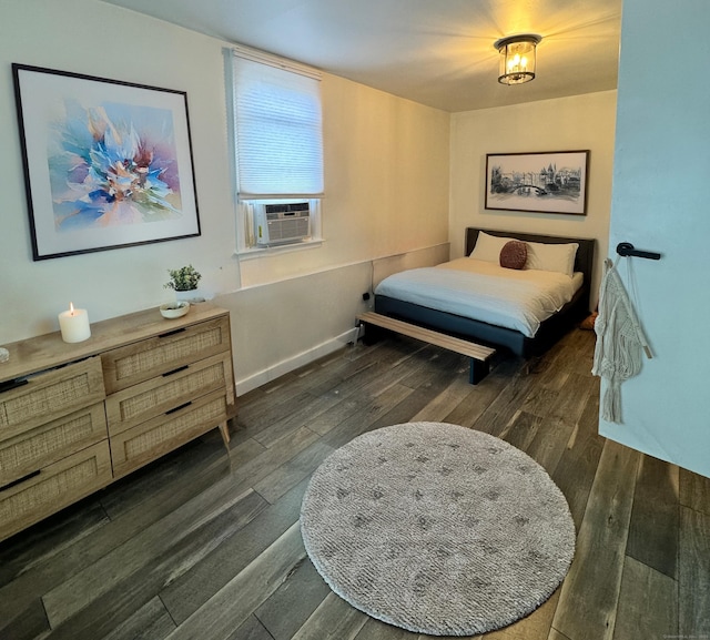bedroom featuring cooling unit and wood finished floors