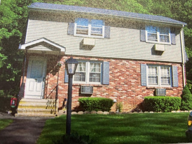 1784 Foxon Rd Unit 2A, North Branford, CT 06471 - view of front of property with a front lawn, brick siding, and entry steps