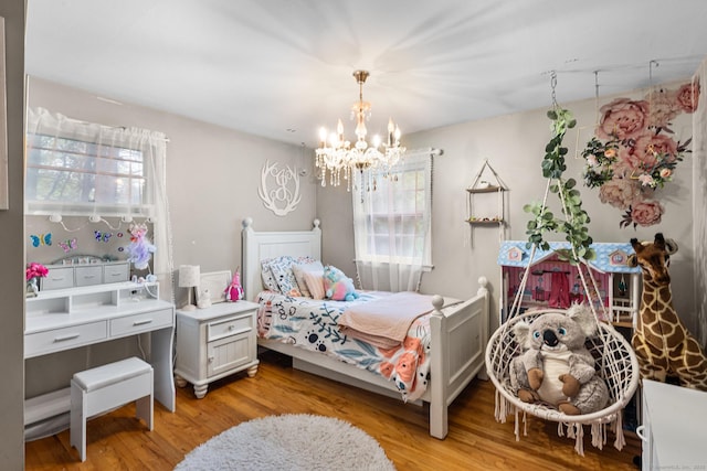 1 Glen Cir, Seymour, CT 06483 - bedroom featuring multiple windows, a chandelier, and light wood-style flooring