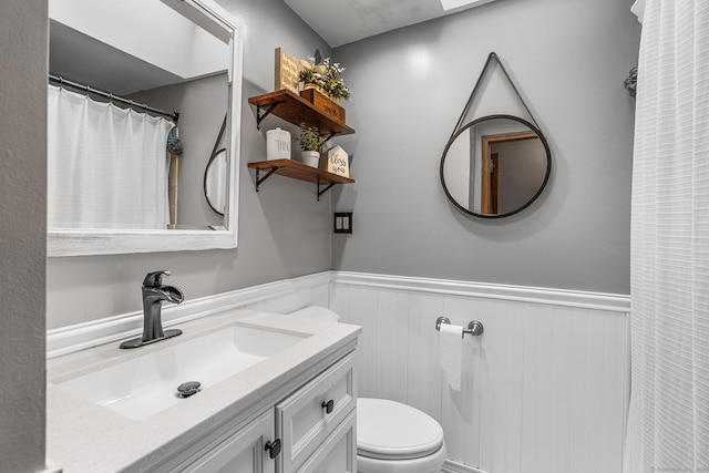 1 Glen Cir, Seymour, CT 06483 - bathroom featuring wainscoting, toilet, and vanity