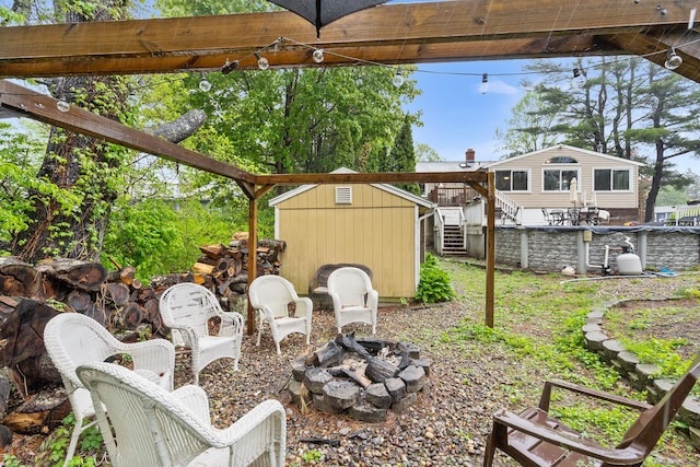 1 Glen Cir, Seymour, CT 06483 - view of yard featuring a storage unit, a fire pit, an outbuilding, and stairs
