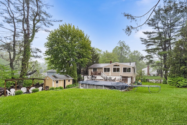 1 Glen Cir, Seymour, CT 06483 - rear view of house with a covered pool, an outdoor structure, a shed, a lawn, and a chimney