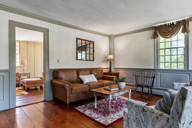 1696 Main St, Glastonbury, CT 06033 - living area with a decorative wall, hardwood / wood-style floors, a baseboard heating unit, crown molding, and wainscoting