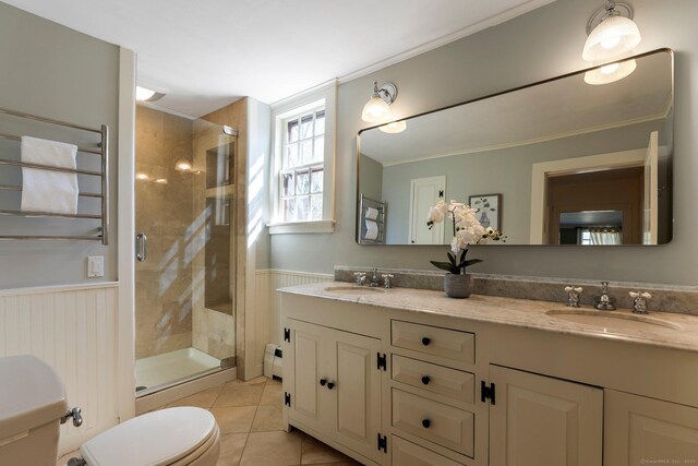1696 Main St, Glastonbury, CT 06033 - full bath featuring a sink, tile patterned floors, a shower stall, baseboard heating, and wainscoting