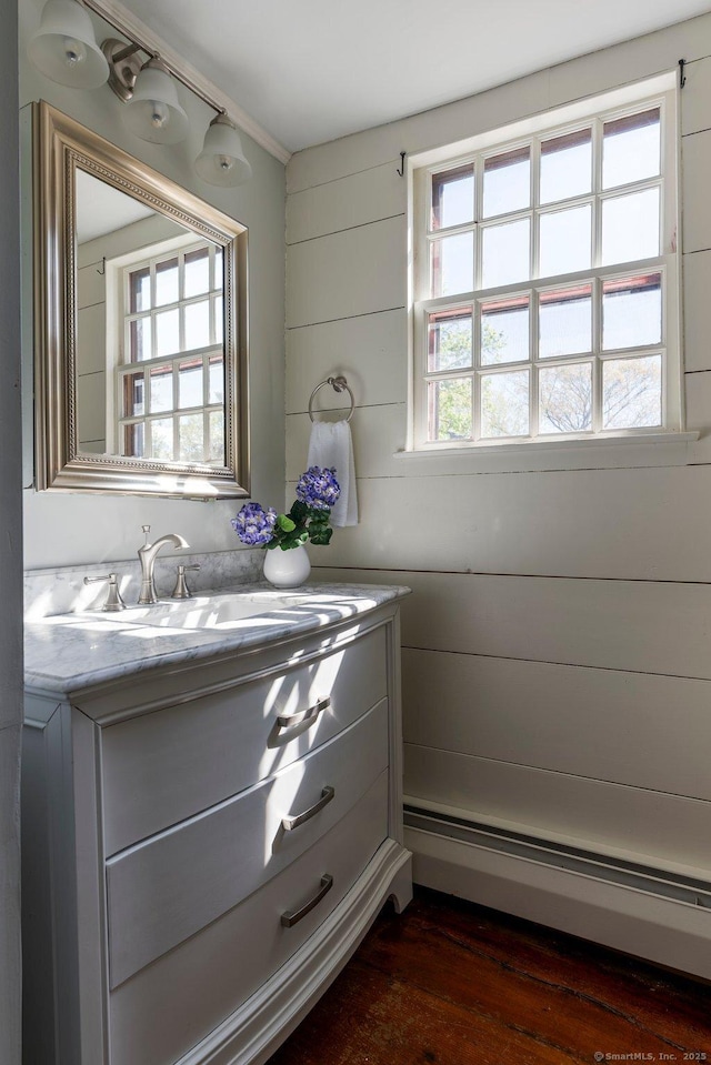 1696 Main St, Glastonbury, CT 06033 - bathroom with vanity, baseboard heating, and wood finished floors