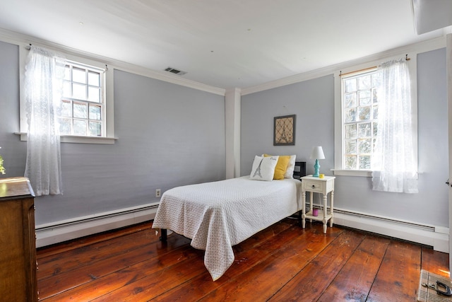1696 Main St, Glastonbury, CT 06033 - bedroom featuring a baseboard heating unit, visible vents, crown molding, wood-type flooring, and baseboard heating