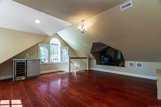 1696 Main St, Glastonbury, CT 06033 - additional living space with visible vents, baseboards, wood-type flooring, and wine cooler