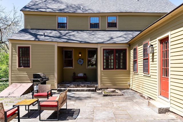 1696 Main St, Glastonbury, CT 06033 - back of house featuring entry steps, a patio, and a shingled roof