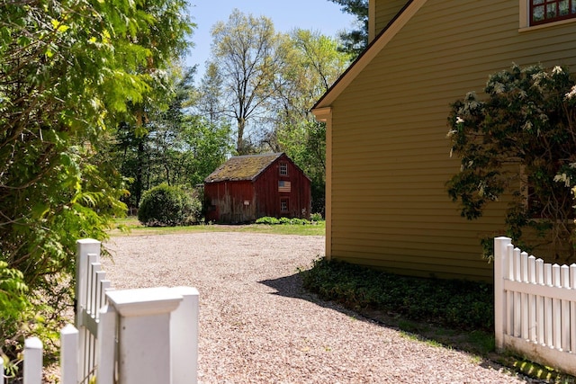 1696 Main St, Glastonbury, CT 06033 - view of yard featuring a shed, fence, and an outbuilding