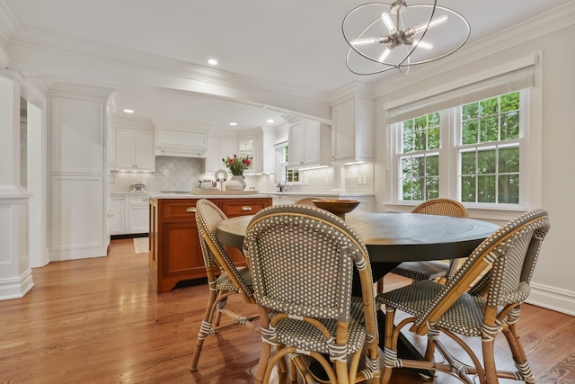 123 Richmond Hill Rd Unit 20, New Canaan, CT 06840 - dining room featuring a chandelier, light wood finished floors, ornamental molding, ornate columns, and recessed lighting