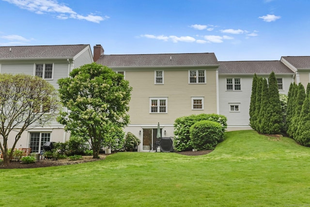 123 Richmond Hill Rd Unit 20, New Canaan, CT 06840 - rear view of house featuring a yard and a chimney