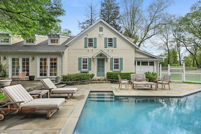 back of house with a patio area, fence, roof with shingles, and french doors