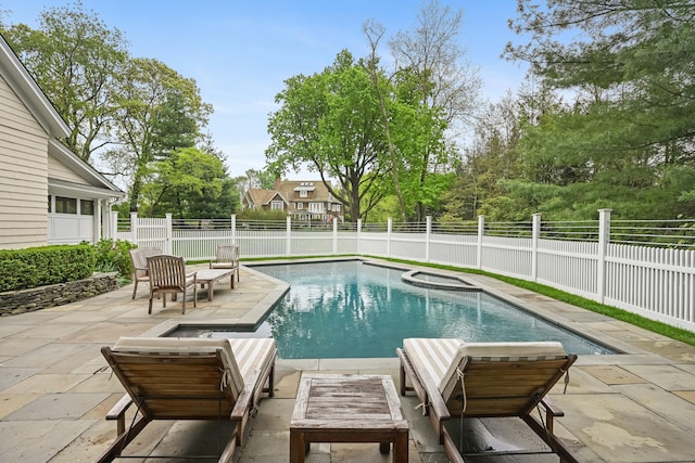 view of pool with a patio area, a fenced backyard, an outdoor hangout area, and a pool with connected hot tub