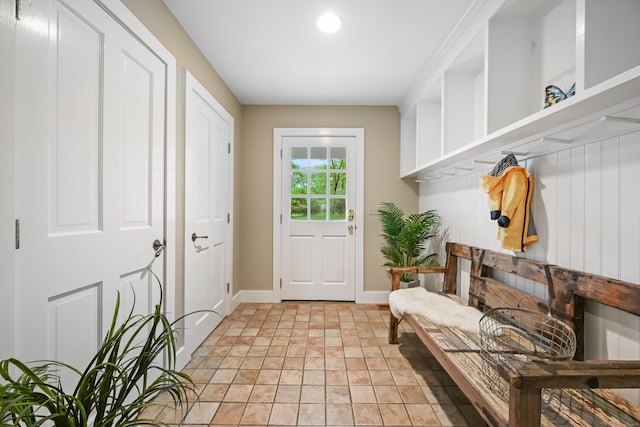 mudroom with baseboards and light stone finish flooring