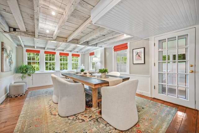 sunroom with beamed ceiling and healthy amount of natural light