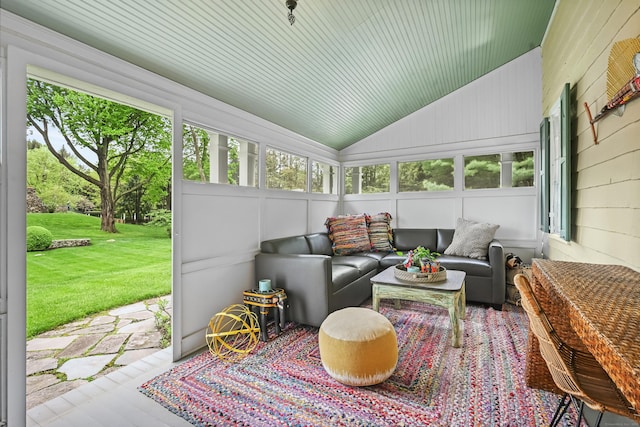 sunroom / solarium with an outdoor hangout area and lofted ceiling