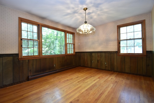 299 Valley Rd, North Branford, CT 06471 - unfurnished room with a baseboard heating unit, a chandelier, wainscoting, light wood finished floors, and wallpapered walls