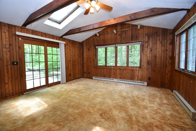 299 Valley Rd, North Branford, CT 06471 - unfurnished room featuring a baseboard radiator, a skylight, plenty of natural light, and wood walls