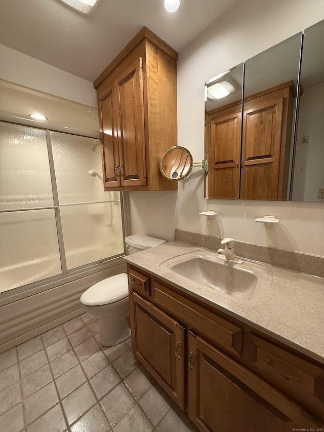299 Valley Rd, North Branford, CT 06471 - full bathroom with vanity, shower / bath combination with glass door, toilet, and tile patterned flooring