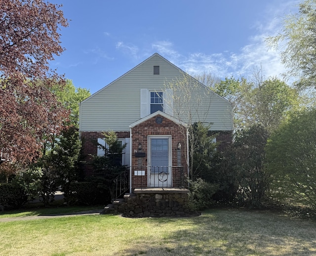 30 May St, Meriden, CT 06451 - traditional-style home with a front yard and brick siding