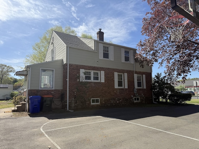 30 May St, Meriden, CT 06451 - rear view of property featuring a chimney and brick siding