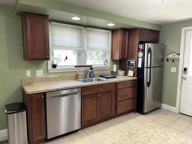30 May St, Meriden, CT 06451 - kitchen with appliances with stainless steel finishes, light countertops, baseboards, light tile patterned floors, and recessed lighting