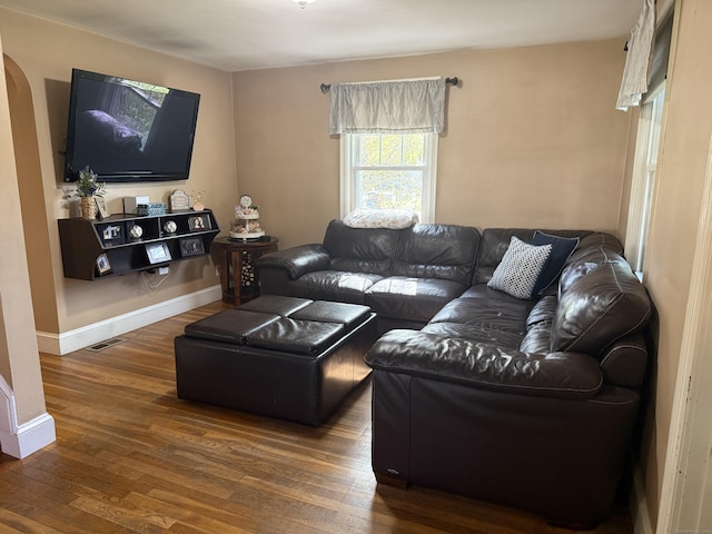 30 May St, Meriden, CT 06451 - living room with wood finished floors, arched walkways, and baseboards