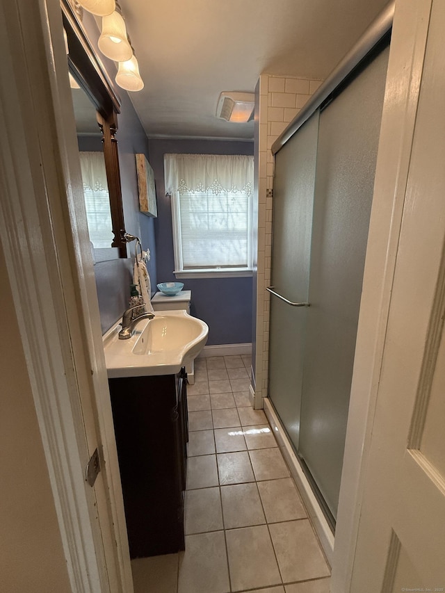 30 May St, Meriden, CT 06451 - full bathroom featuring vanity, tile patterned flooring, a shower stall, toilet, and baseboards