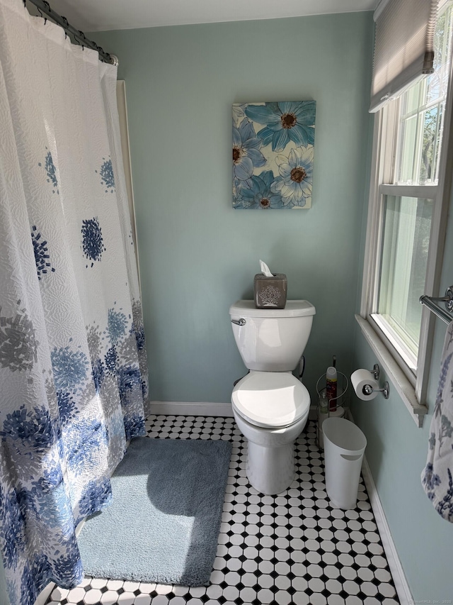 30 May St, Meriden, CT 06451 - bathroom featuring toilet, baseboards, and a shower with shower curtain