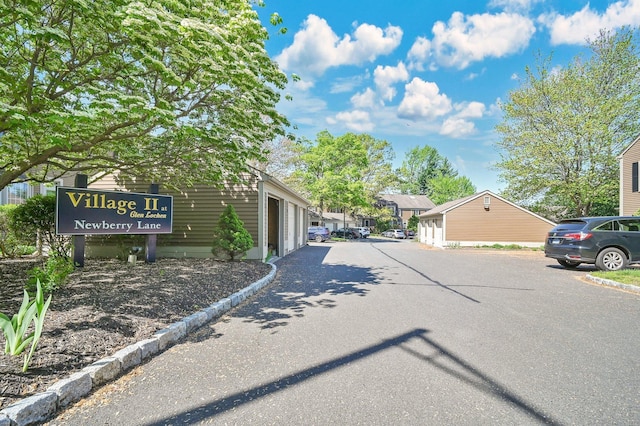 view of asphalt road featuring a residential view