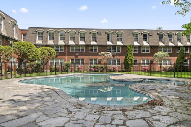 view of pool with fence